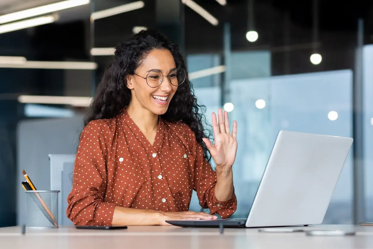 Woman looking at her laptop in an office