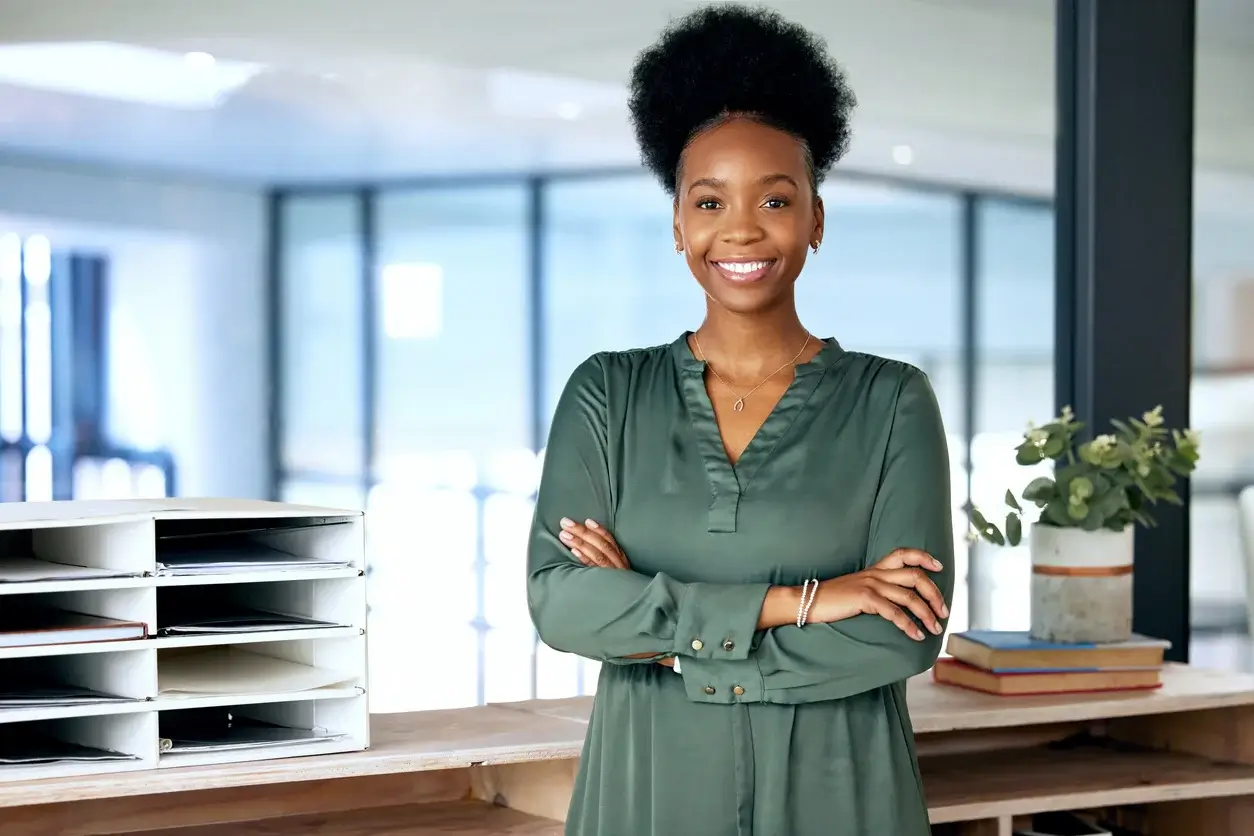Woman in an office with her arms crossed