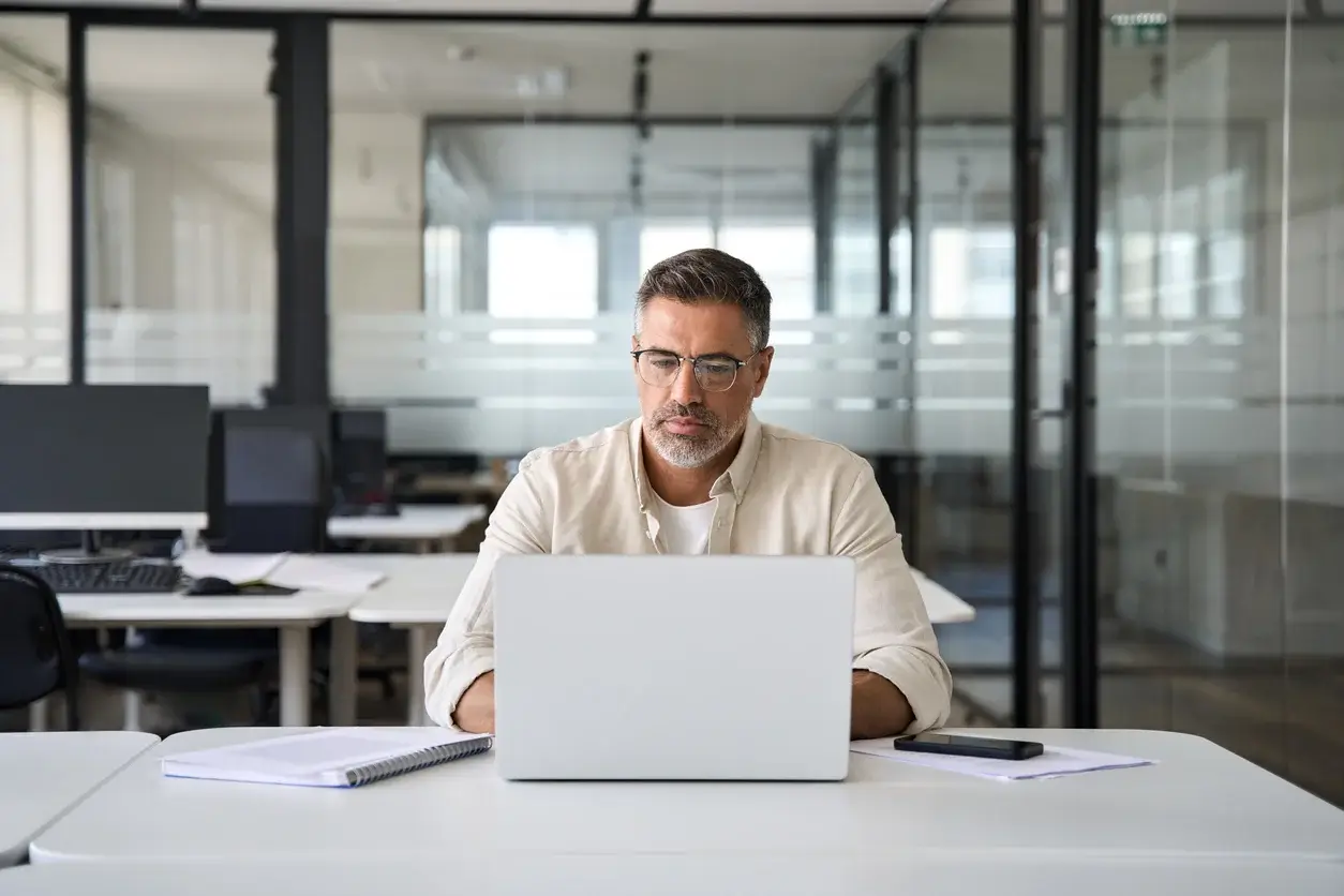 Man working at a computer in an office