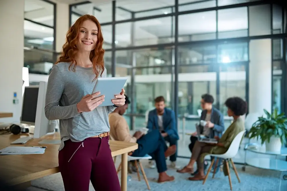 Woman standing with a tablet