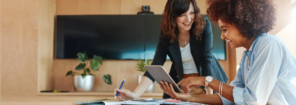 Two women working together in an office